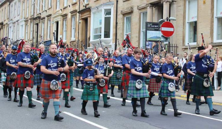 The Piping Live! Big Band parading down West George Street in 2017.